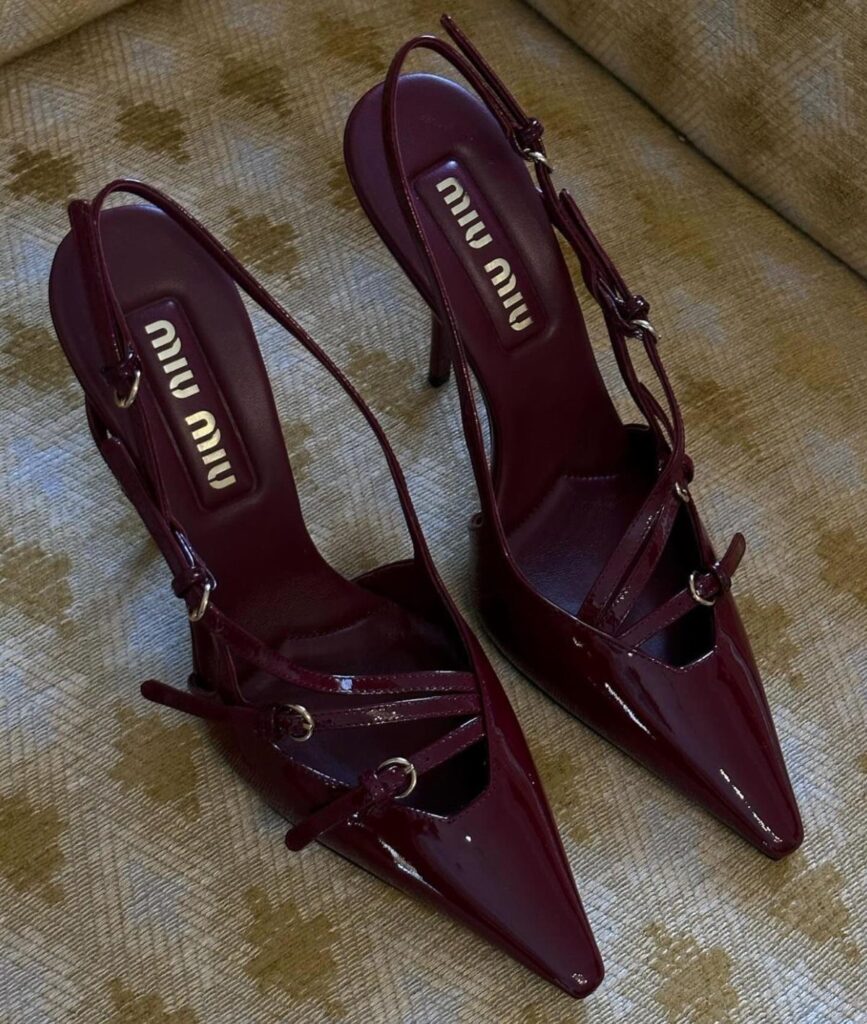 Burgundy patent leather miu miu high heels with pointed toes on patterned fabric