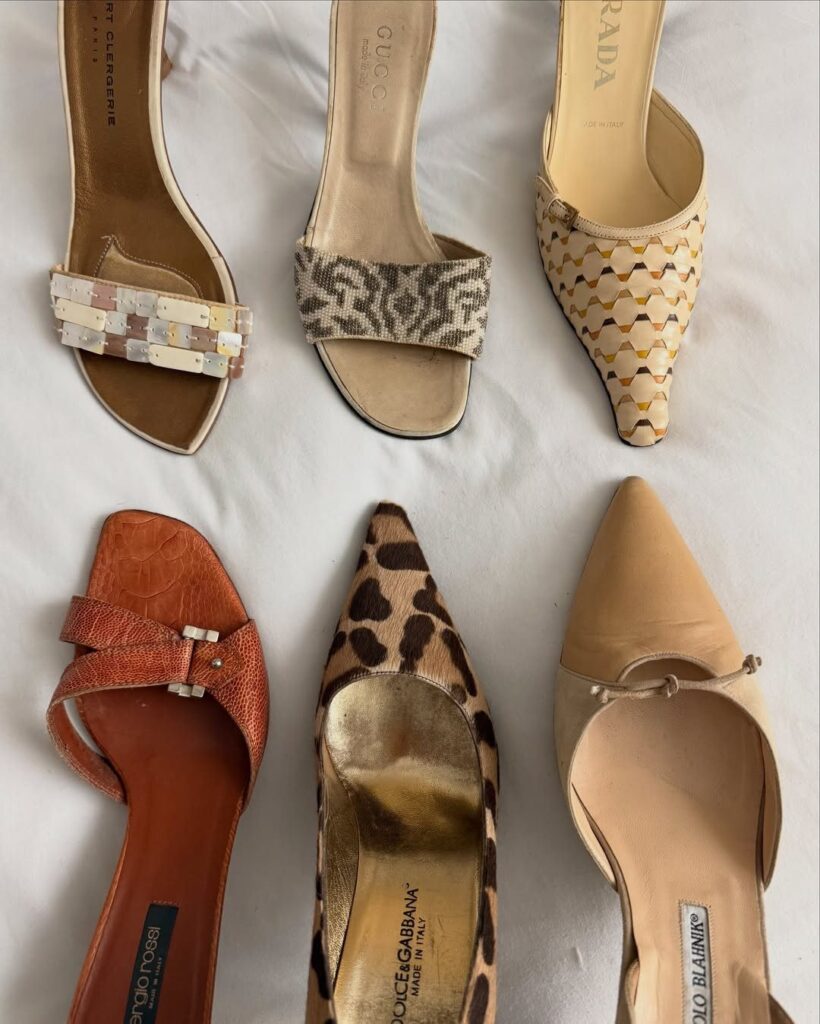 Six pairs of vintage mule heels in various patterns on a white background.
